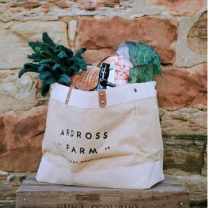 jute bag stuffed with grocery shopping