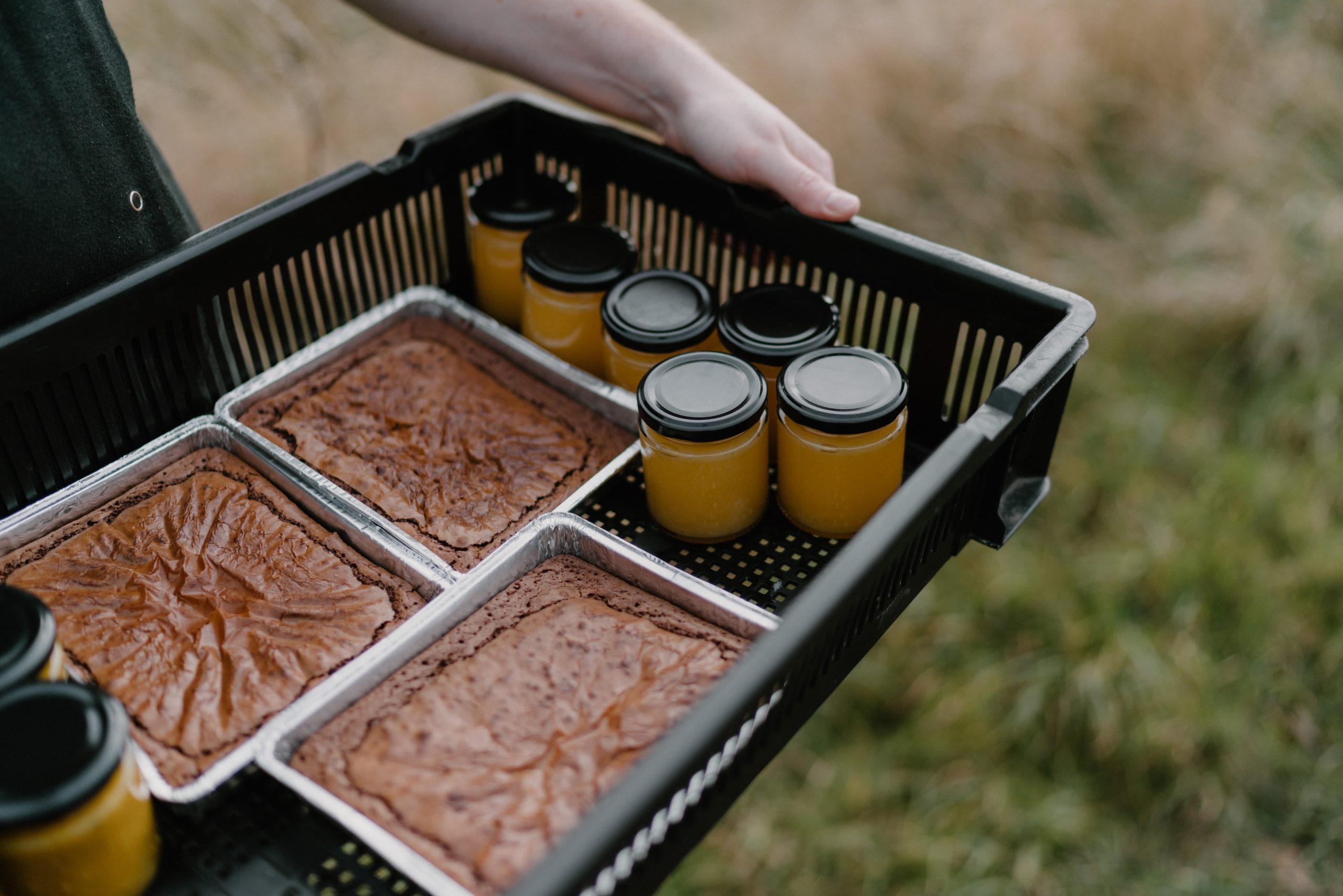 a tray of brownies and lemon curd