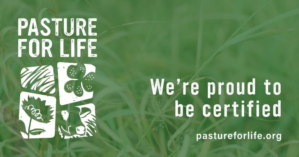 Pasture for life logo on a green back ground.