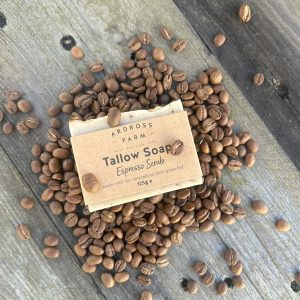 bar of tallow soap lying in espresso beans