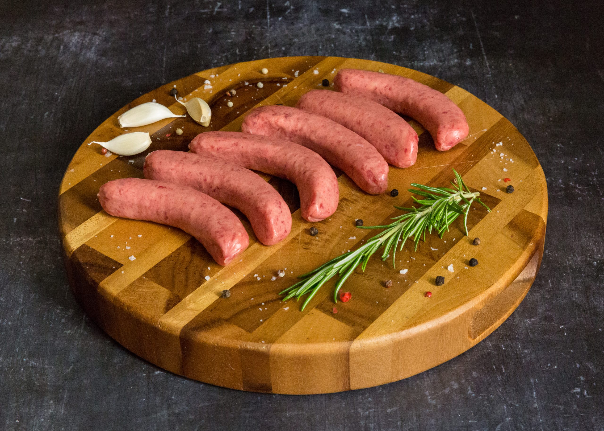steak sausage on a wooden chopping board