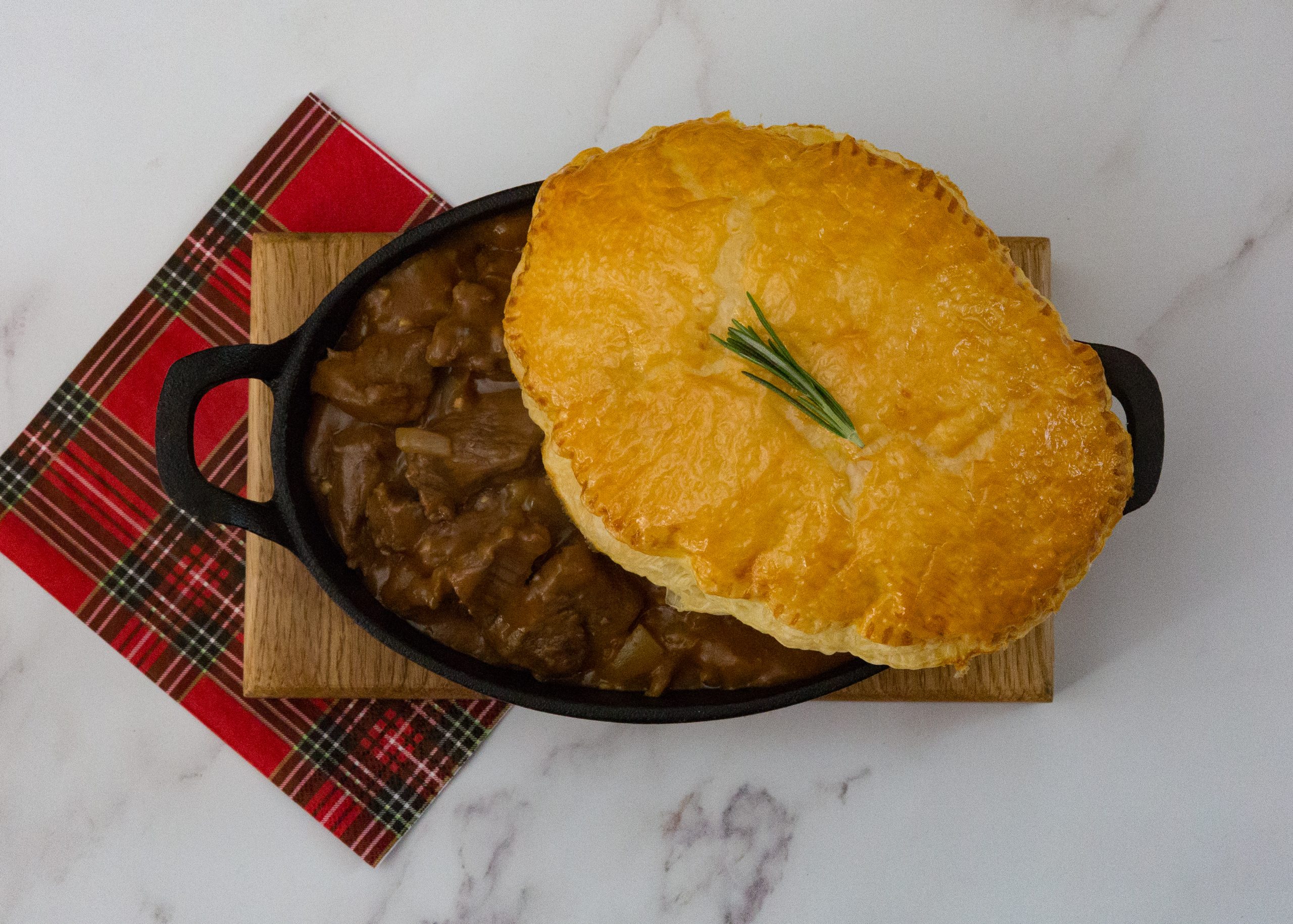 oval steak pie with tartan napkin