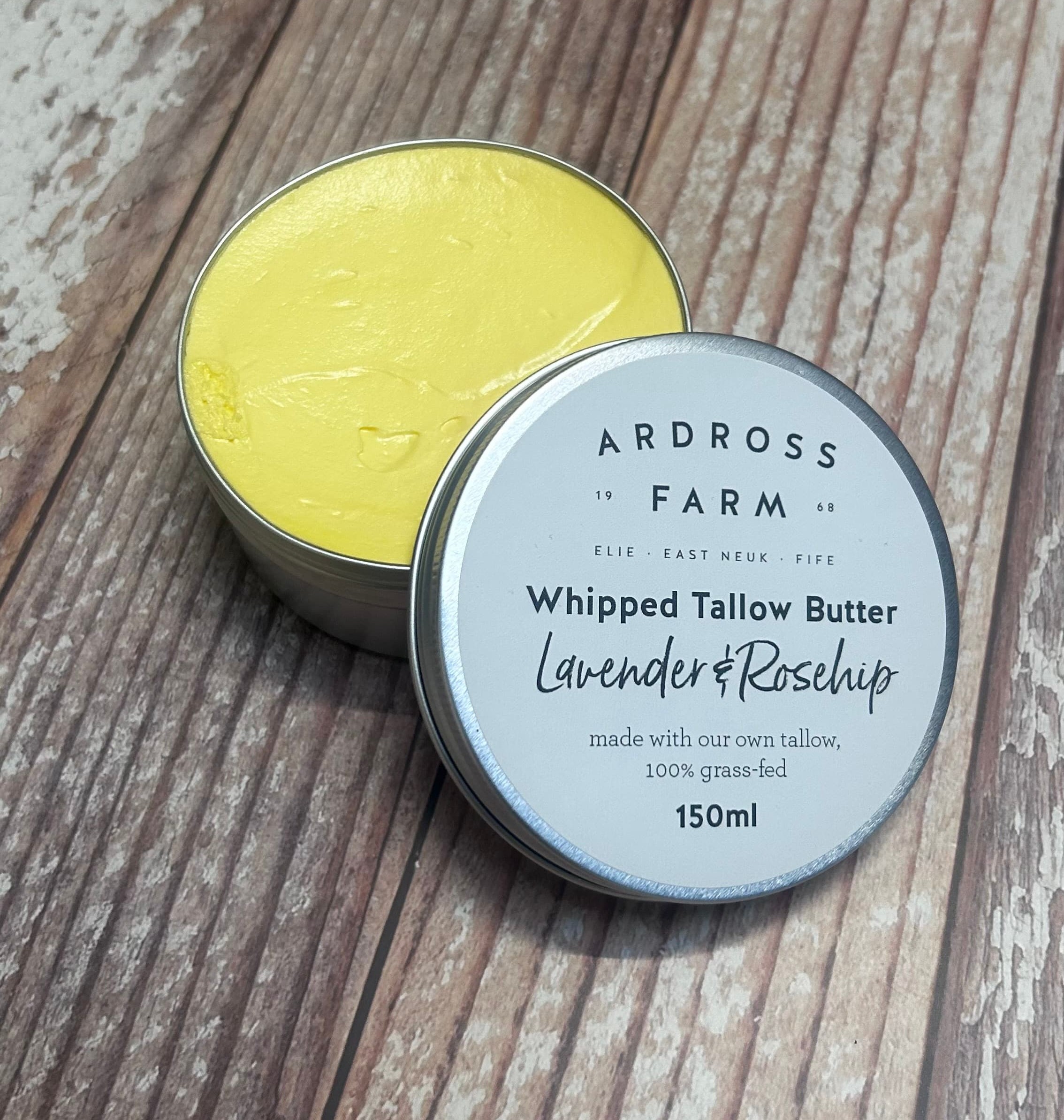 An open aluminum tin with whipped tallow butter