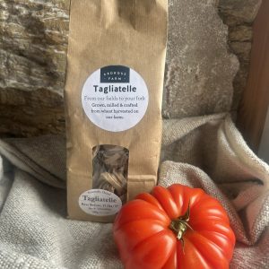Tagliatelle pasta in a brown bag with beef tomatoes